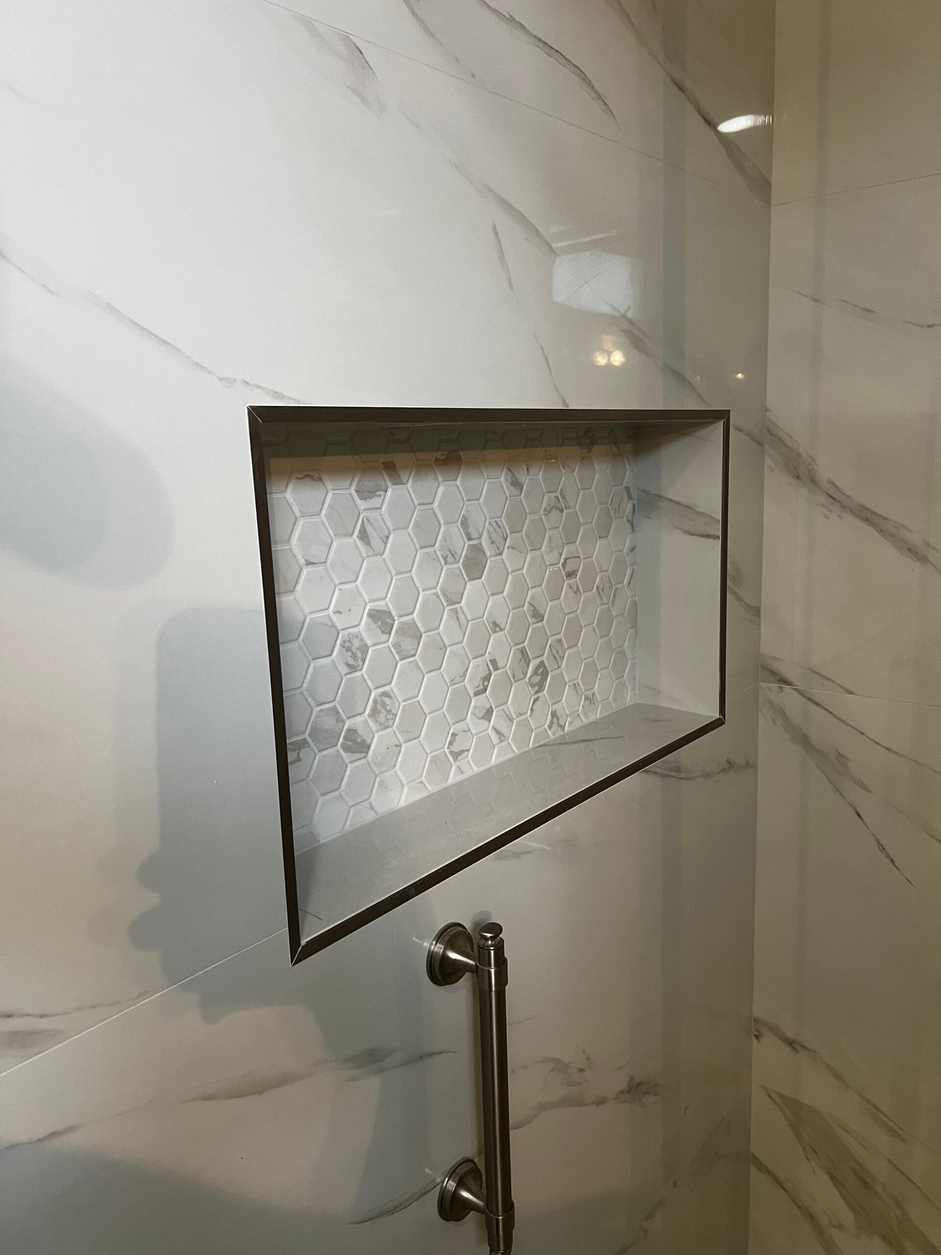Completed bathroom remodeling project in Hollywood FL with frameless glass shower