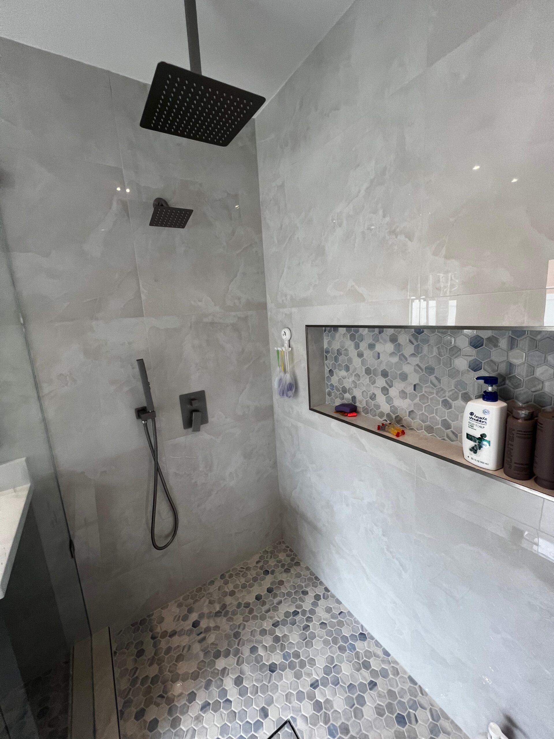 Guest bathroom remodel in Hollywood FL with floating vanity and large format tile